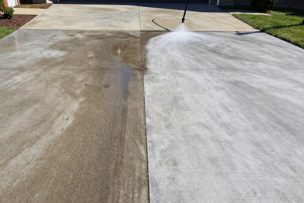 Concrete driveway powerwashing in progress