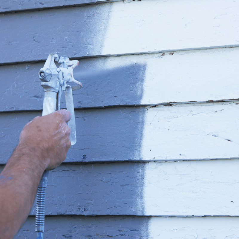 Professional application of exterior paint on commercial building in South Amboy